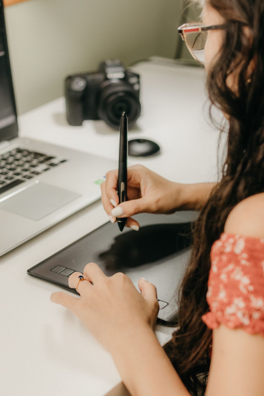 A designer drawing on a pen tablet